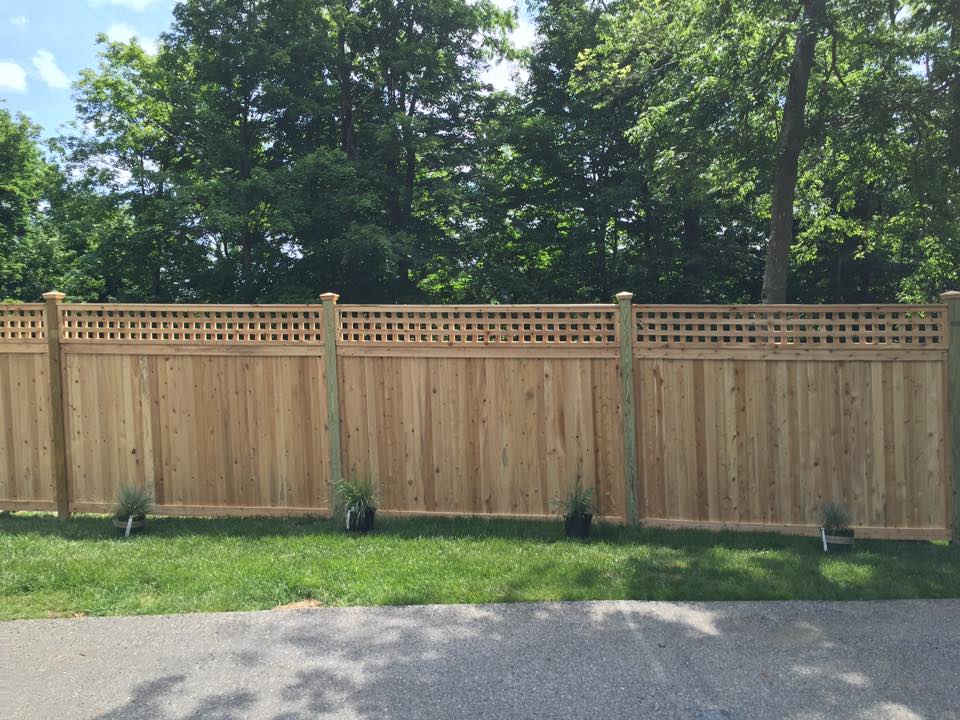 Oklahoma wood fence with lattice topper